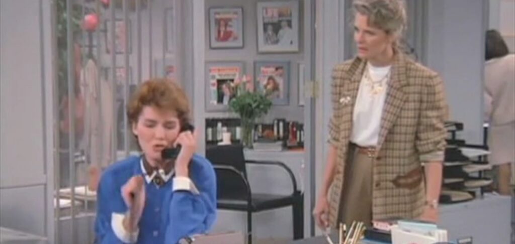 Murphy Brown with one of her rotating cast of secretaries