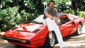 Tom Selleck poses on the Magnum PI Ferrari