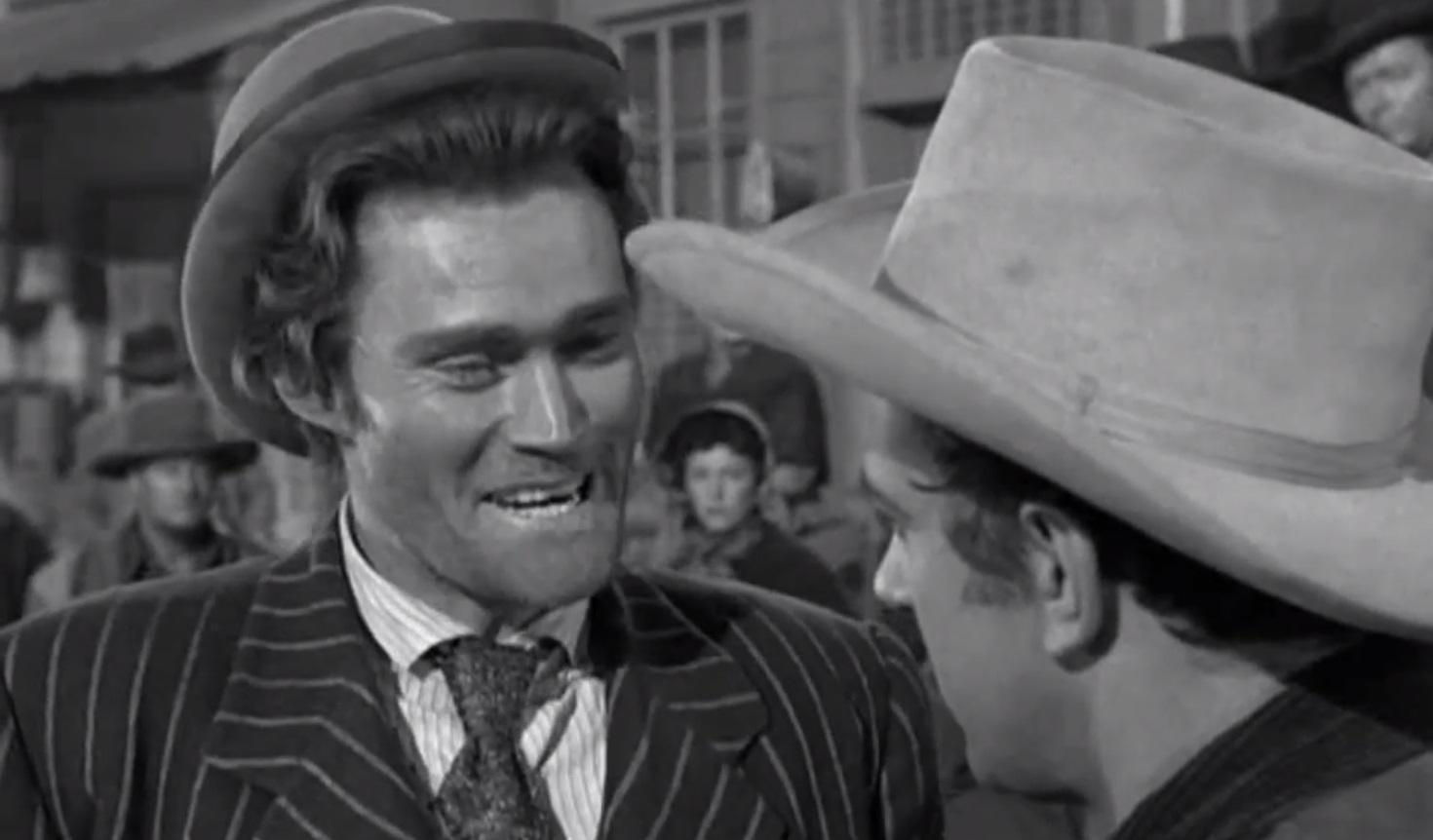 Chuck Connors "towering" over James Arness