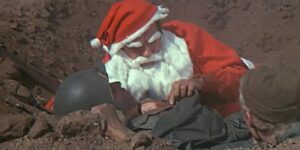 Hawkeye doing combat surgery dressed as Santa Claus