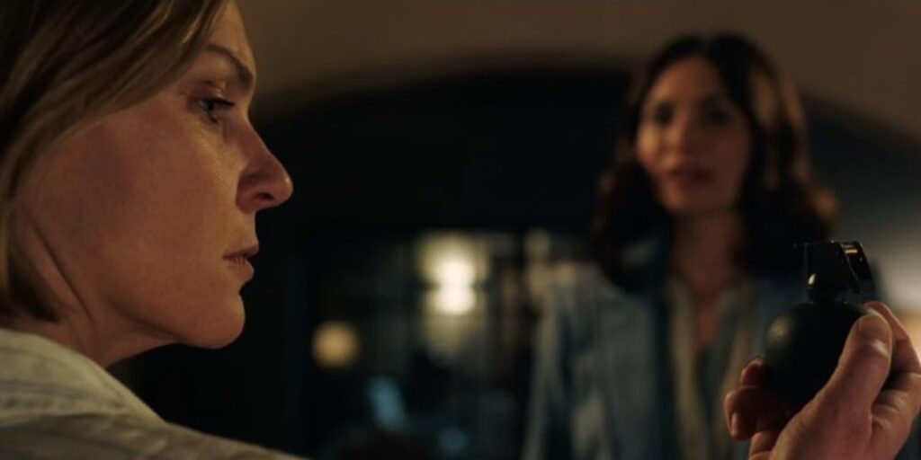 Carol looks at her grenade